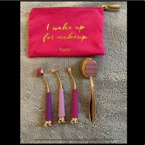 4 paddle-style makeup brushes made by tarte